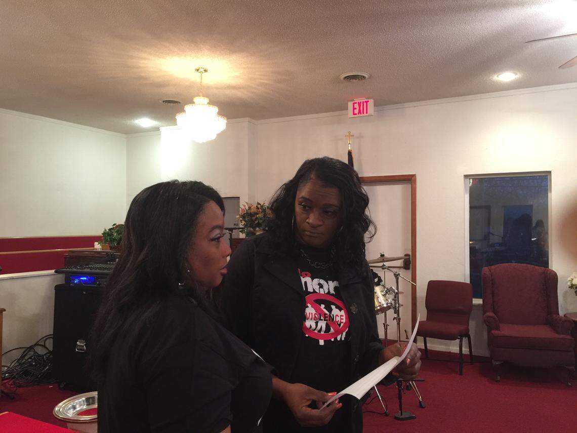 Jevette Bacy-Waters, Jasmine Adams' cousin, and Patricia Allen, founder of an anti-violence advocacy group, talk during a prayer celebration Saturday where people gave thanks for Adams safe return.