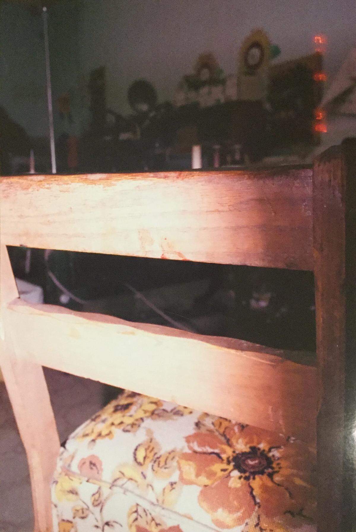Bloody fingerprints were found on a chair inside the shop where Dana Bowman was killed.