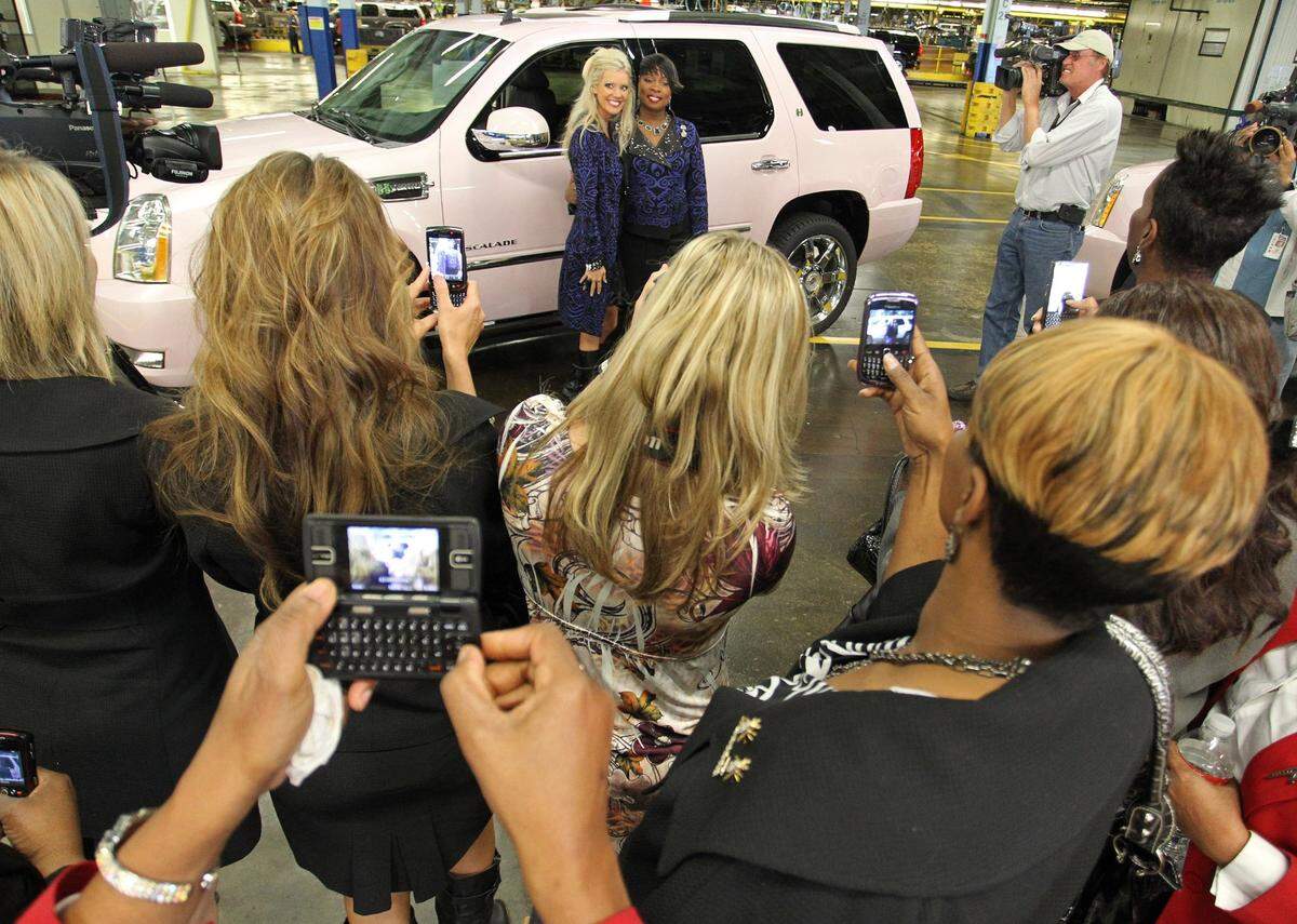 March 10, 2011: Kimberly Copeland and Lorraine Newton pose next to one of the pink Escalades that a select group of Mary Kay’s top businesswomen recieved at the GM Arlington Assembly plant. Three were chosen to drive their SUVs off of the assembly line and out of the plant.