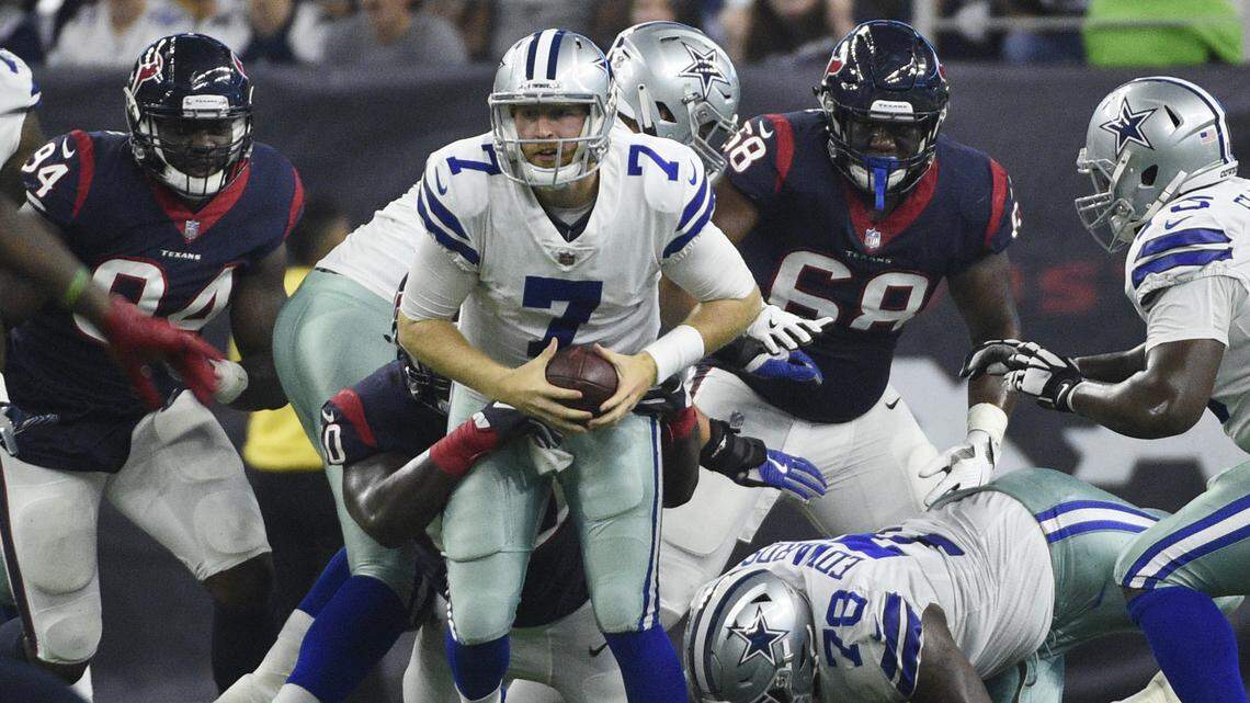 Cowboys quarterback Cooper Rush is pressured by Houston Texans defensive tackle Kingsley Opara during the first half of Thursday night’s preseason finale at NRG Stadium in Houston. The Texans won 14-6 and Rush threw two interceptions.
