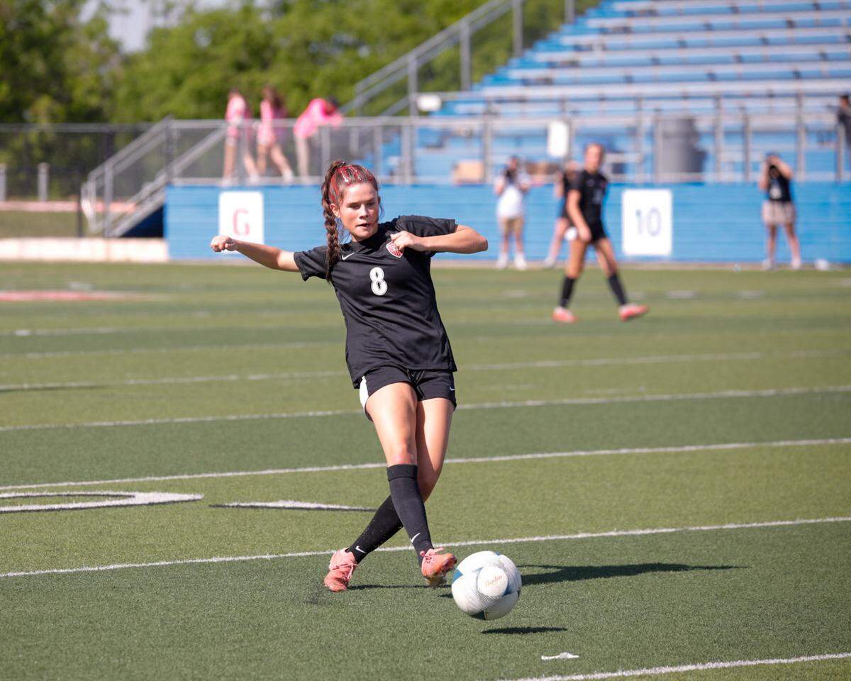Colleyville Heritage sophomore midfielder Addison Bizjack goes for the ball in the girls’ Class 5A Division 1 UIL high school soccer state championship vs. College Station A&M Consolidated at Birkelbach Field in Georgeown on Friday, April 11, 2025.