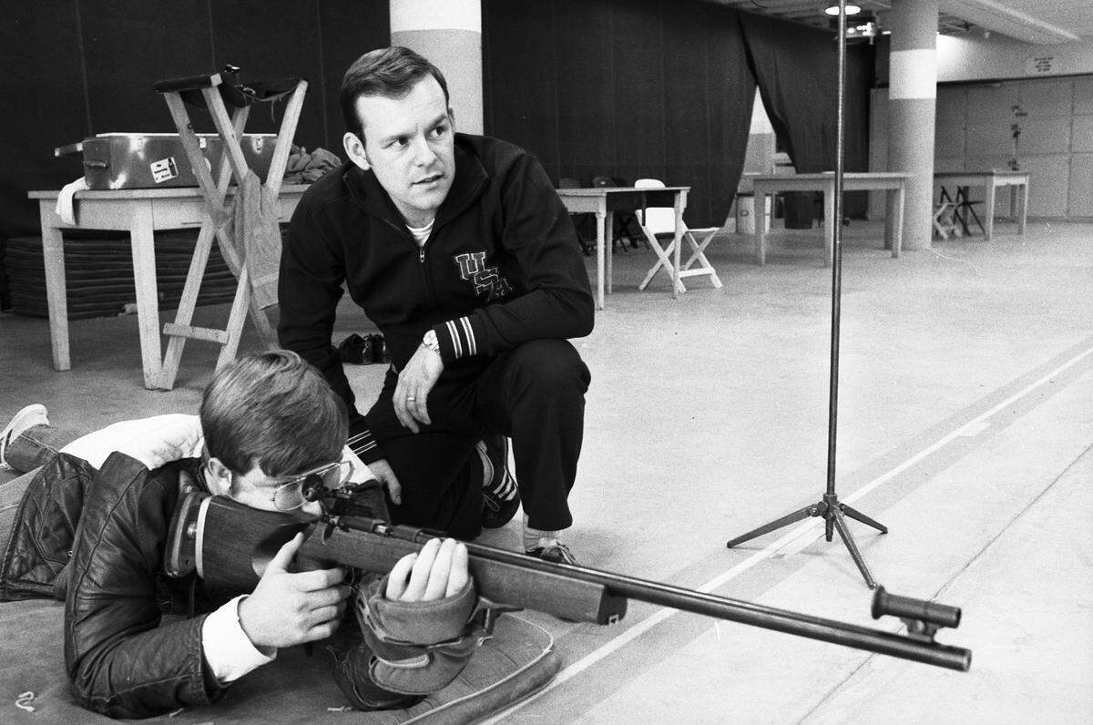 Nov. 7, 1974: Lanny Bassham, kneeling, shows a University of Texas at Arlington student some points in target shooting at UTA’s range. Bassham is recognized as one of the world’s two or three best shooters in 300-meter competition.