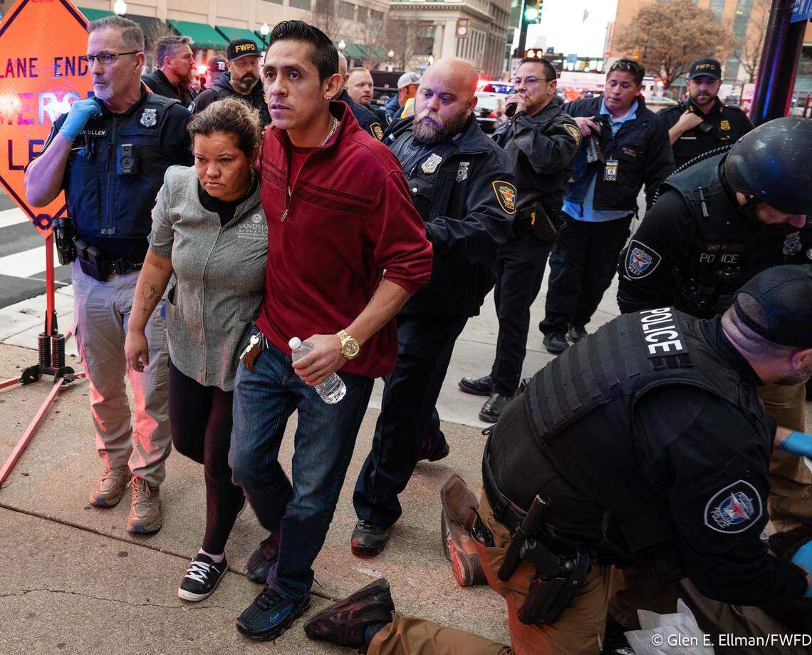 Fort Worth police and firefighters respond to the explosion at the Sandman Signature Hotel, where first-responders rescued multiple people Monday. Twenty-one were injured and fourteen were transported to hospitals, with one in critical condition.