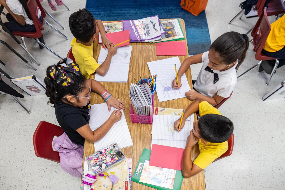 Bilingual teacher Miguel Fijó Mezquita’s students work on their classwork as he teaches them Spanish at Annie Webb Blanton Elementary School in Dallas on Tuesday, Oct. 22.