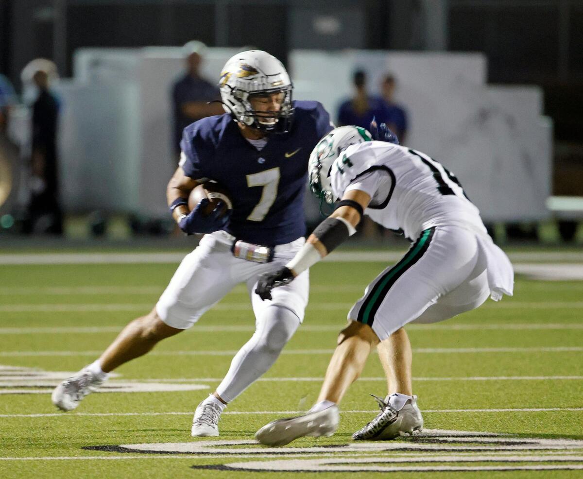 Keller defensive back Ryan Ventura (7) intercepts a ball intended for Carroll wide receiver Clayton Wayland (14) in the first half of a UIL football game at Keller ISD Stadium in Keller, Texas, Thursday, Oct. 05, 2023. Carroll led Keller 35-0 at the half. (Special to the Star-Telegram Bob Booth)