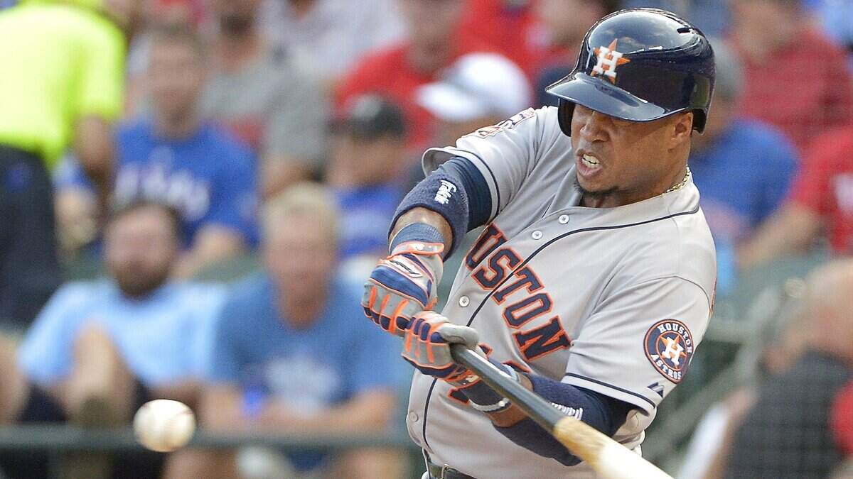 Houston Astros third baseman Luis Valbuena (18) gets a RBI single during the second inning as the Houston Astros play the Texas Rangers in MLB at Globe Life Park in Arlington, TX, Tuesday, Aug. 4, 2015. (Star-Telegram/Max Faulkner)