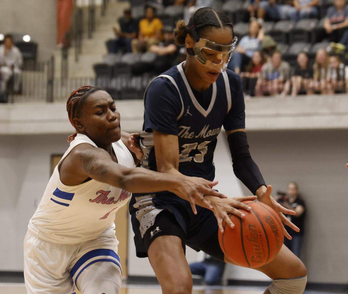 North Crowley guard Jamari Milton (1) reaches in on Flower Mound guard Maci Pringle (23) during the first half of a UIL Class 6A Division I girls regional final basketball playoff game at Arlington ISD Athletics Center in Arlington, Texas, Friday Feb. 27, 2026.