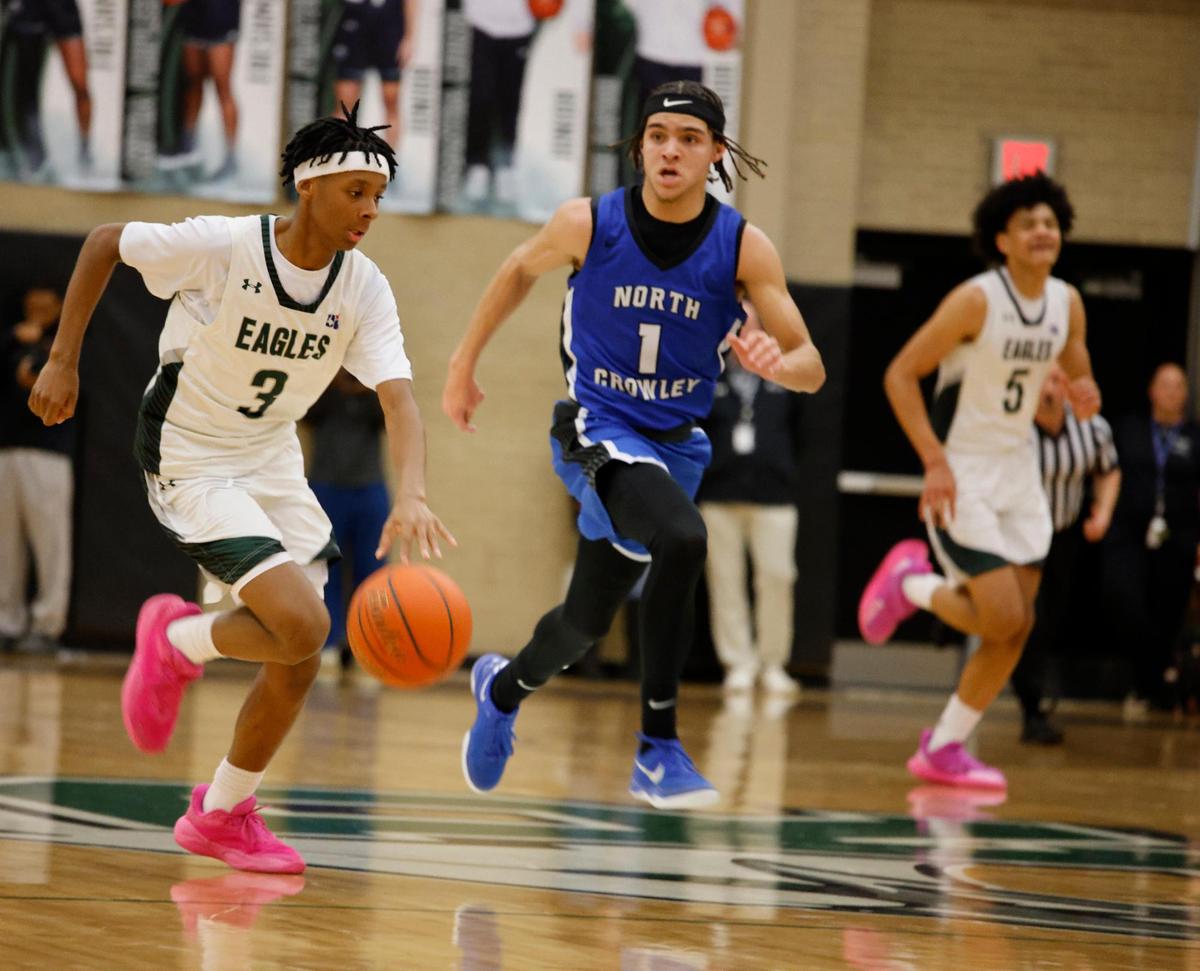 Lakeridge guard Roman Dulin (3) brings the ball down court during a UIL boys basketball game at Lake Ridge High School in Mansfield, Texas, Tuesday, Jan. 24, 2025.