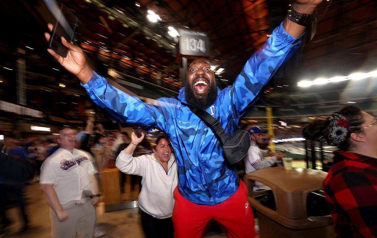 Fans react after the Texas Rangers win the World Series against the Arizona Diamondbacks on Wednesday, November 1, 2023, at a watch party at Globe Life Field in Arlington.