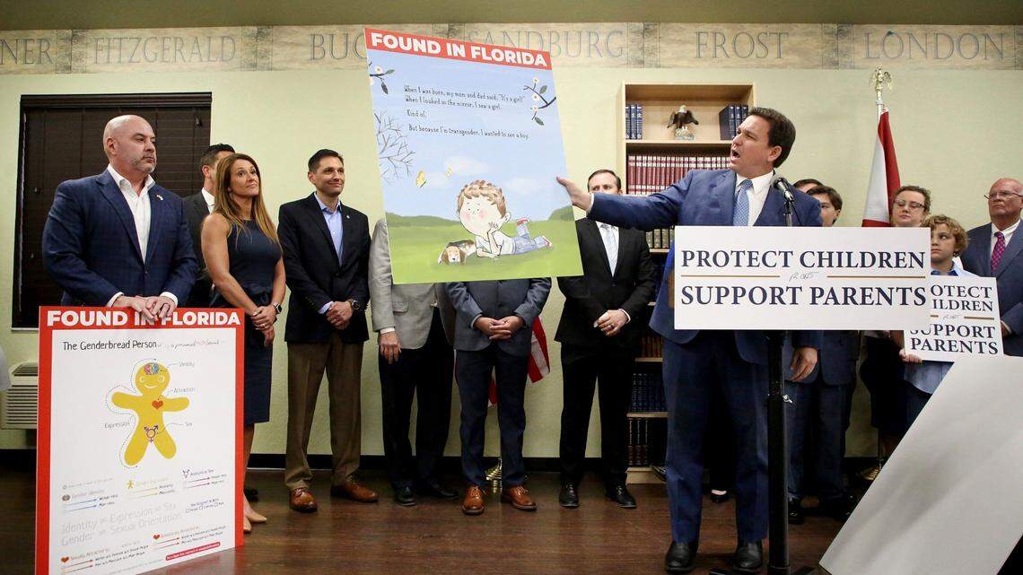 Florida Gov. Ron DeSantis shows an image from the children’s book Call Me Max by transgender author Kyle Lukoff moments before signing the Parental Rights in Education bill during a news conference on March 28. (Douglas R. Clifford/Tampa Bay Times via AP)