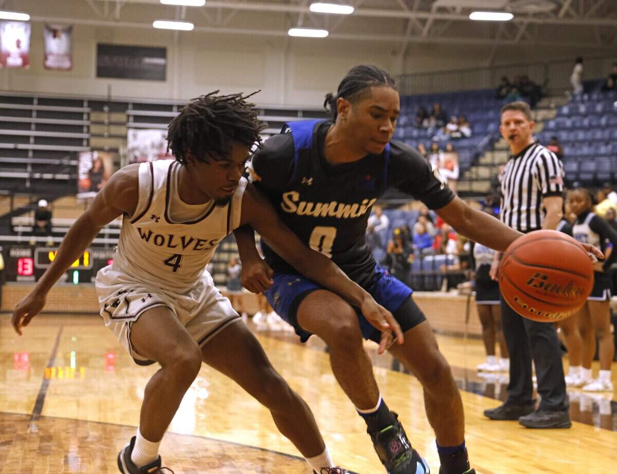 Mansfield Timberview guard Zach Kennedy (4) forces Mansfield Summit guard Mason Williams (0) off the baseline during the first half of a UIL boys basketball game at Mansfield Timberview High School in Arlington, Texas, Tuesday Feb. 10, 2026.