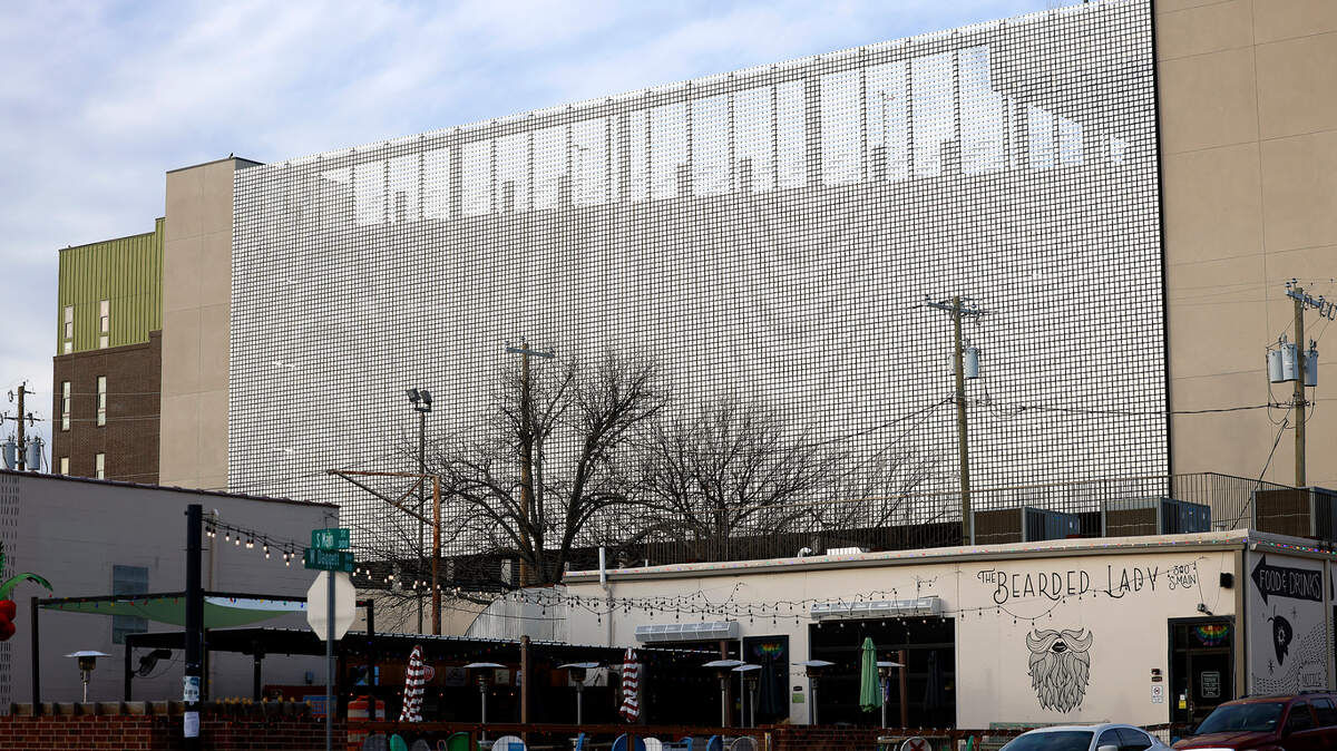 The “kinetic wall” conceals the parking garage of Willow & Wise apartments near South Main Street. Thousands of small aluminum panels move with the wind, creating a dazzling effect.