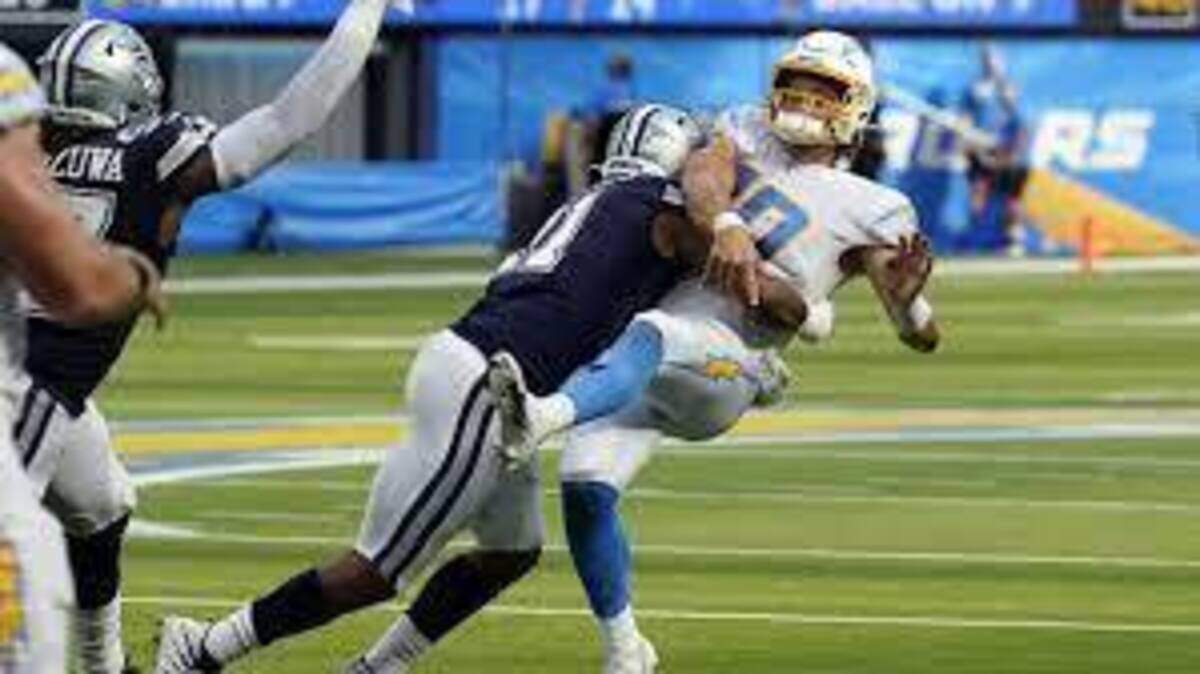 Los Angeles Chargers quarterback Justin Herbert is hit by Dallas Cowboys linebacker Micah Parsons in a Week 2 game in 2021.. The teams play a preseason game on Saturday.