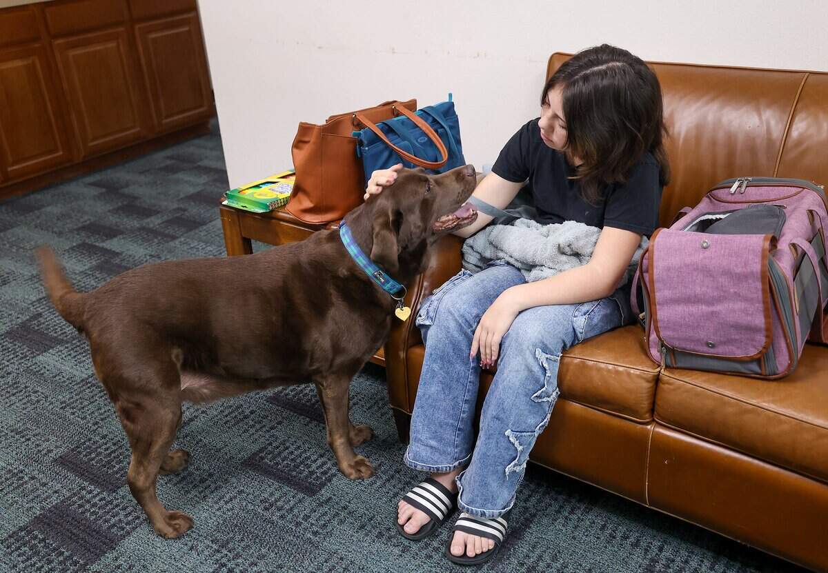 Kyoni TePaa pets the Science, Etc. mascot Birdie will visiting the organization with her mother, Angela, on Tuesday, 9, 2025, in Fort Worth. TePaa is homeschooled and looking into taking supplemental courses at Science, Etc.
