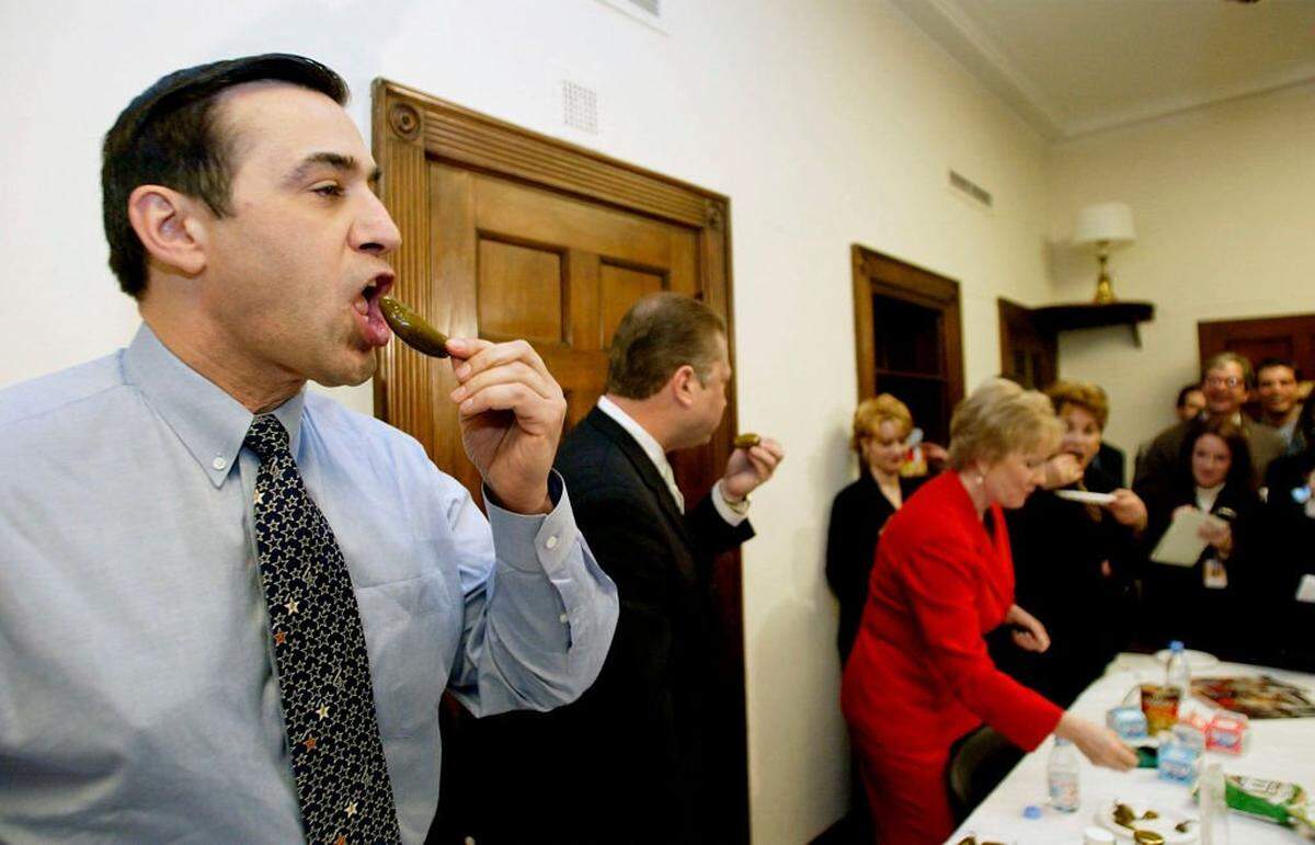 US Rep. Darrell Issa (R-CA), (L) competes with past Jalapeno eating champion Rep Max Sandlin (D-TX), (C) along with Reps Kay Granger (R-TX) (2ndR)and Anna Eshoo (D-TX), (R) at the US Capitol 12 February 2003 in Washington, DC. The Chili Pepper Magazine from Ft. Worth, Texas, sponsored the event which was attended by six members of Congress where Rep. Joe Baca (D-CA) won the title of "Zestiest Legislator" after consuming 47 Jalapeno peppers . AFP PHOTO/Stephen JAFFE (Photo by STEPHEN JAFFE / AFP) (Photo by STEPHEN JAFFE/AFP via Getty Images)