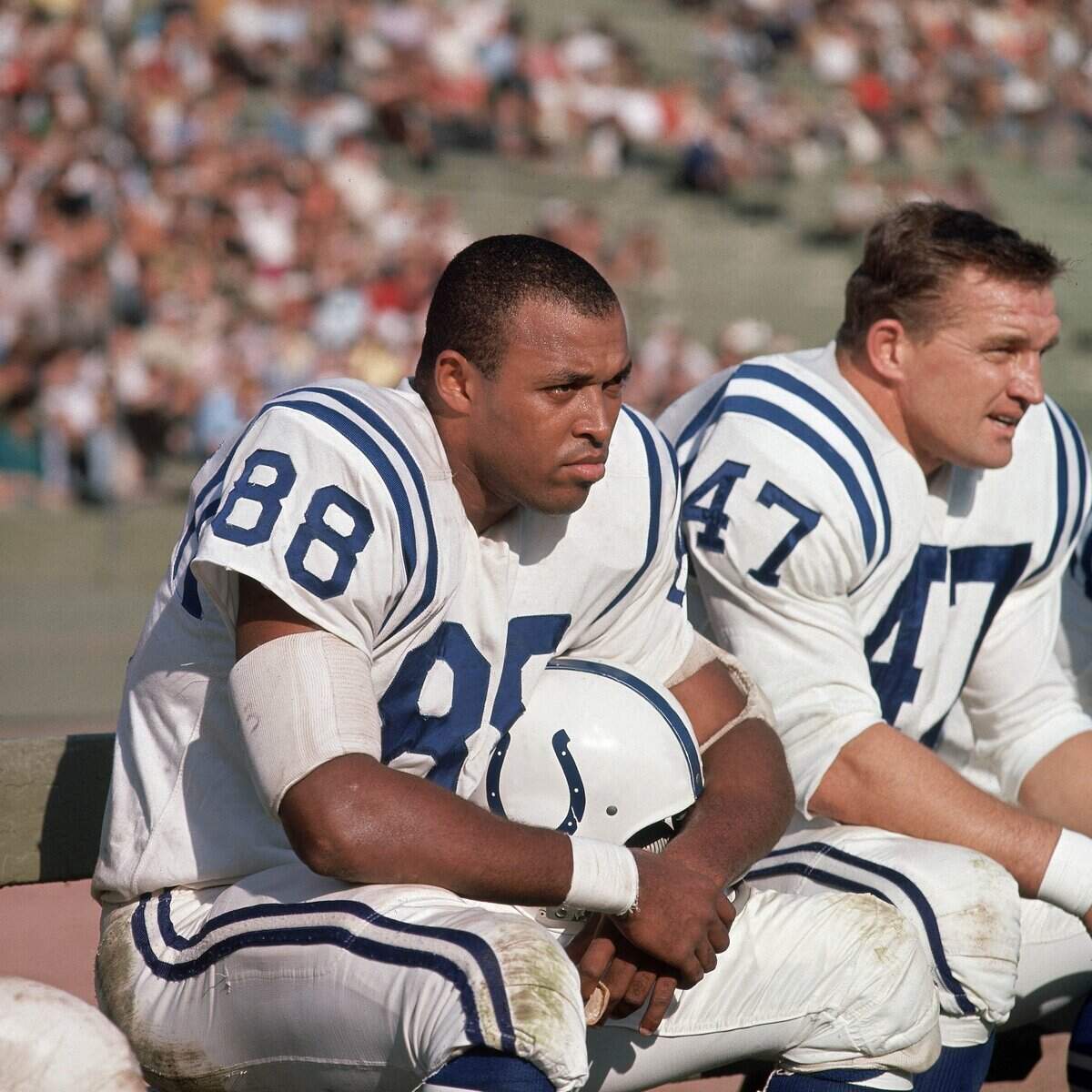 On Nov 24, 1963, Baltimore Colts tight end John Mackey (88) and kicker Jim Martin (47) sit on the bench during the game against the Los Angeles Rams at Memorial Coliseum.