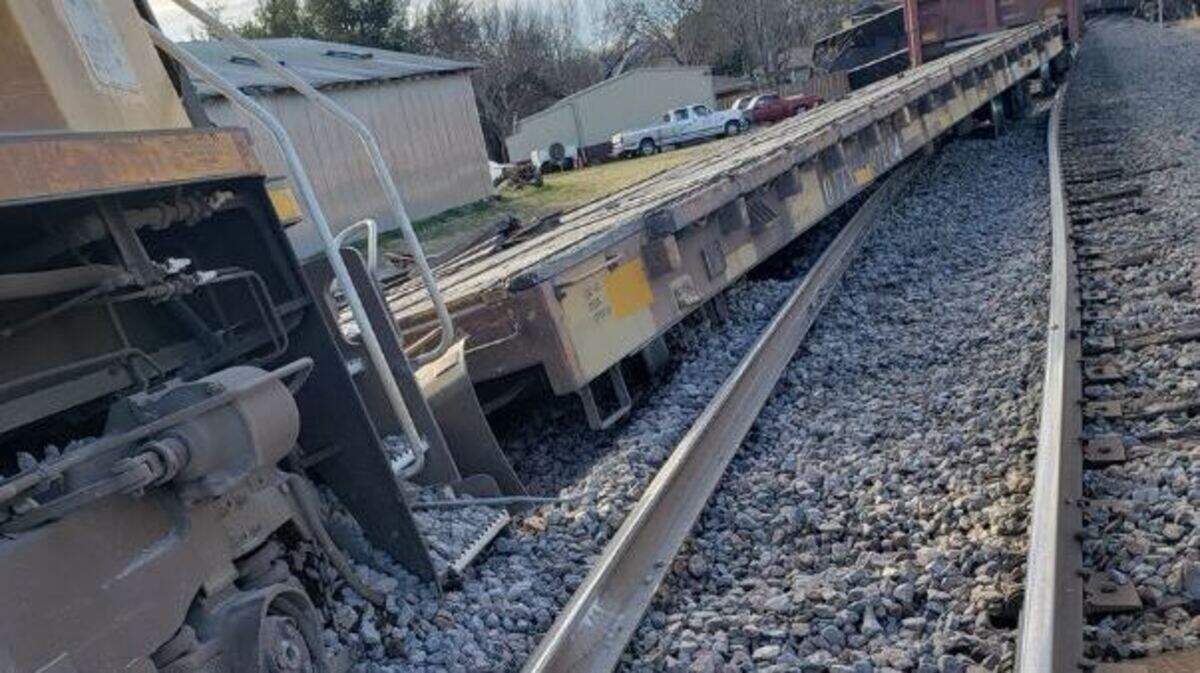 A train derailment in Aubrey Wednesday shown in a photograph on the twitter feed of Capt. William Townsend, Aubrey police, barely misses damaging a house