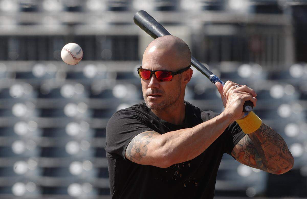 Sep 11, 2024; Pittsburgh, Pennsylvania, USA; Miami Marlins manager Skip Schumaker (45) hits fungos before a game against the Pittsburgh Pirates at PNC Park. Mandatory Credit: Charles LeClaire-Imagn Images