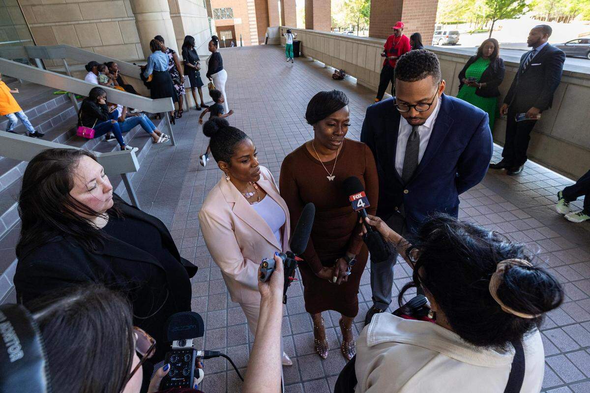 Crystal Mason, center, and her attorneys answer questions regarding her acquittal in a high-profile voting rights case at the Tim Curry Criminal Justice Center in Fort Worth on Friday, March 29, 2024. The Texas Second Court of Appeals reversed Mason’s conviction on Thursday evening where she had faced five years in prison for submitting a provisional ballot in Tarrant County in 2016 that was never counted as a vote.