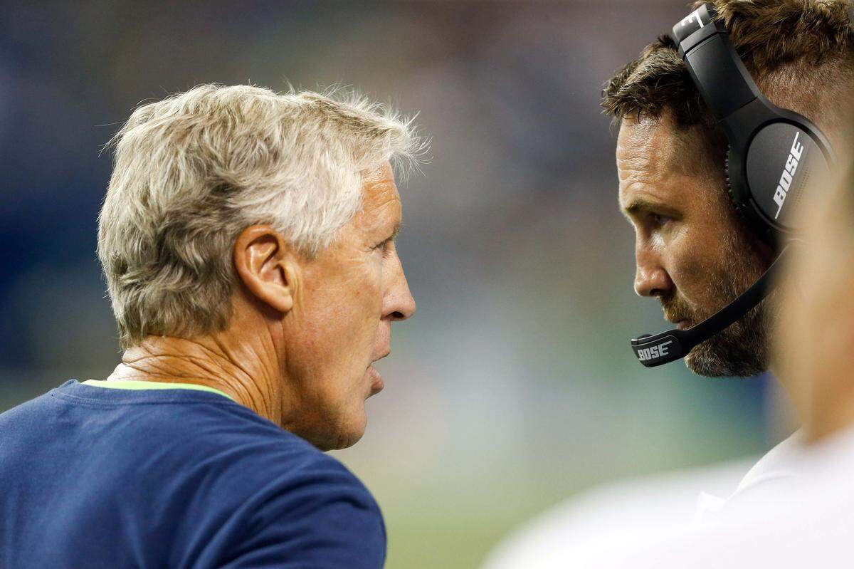 Aug 9, 2018; Seattle, WA, USA; Seattle Seahawks head coach Pete Carroll, left, talks with offensive coordinator Brian Schottenheimer during the fourth quarter against the Indianapolis Colts at CenturyLink Field. Mandatory Credit: Joe Nicholson-USA TODAY Sports