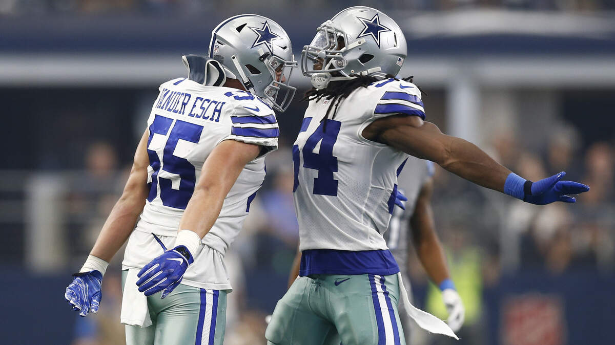 Dallas Cowboys linebackers Leighton Vander Esch, left, and Jaylon Smith celebrate a tackle against the Lions on Sept. 30. They are tied for the team lead with 50 tackles each through six games.