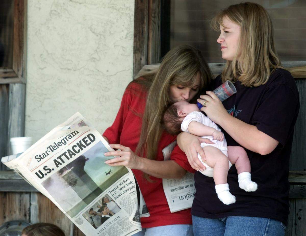 Sandra Johnston of Fort Worth kisses her 3-month-old granddaughter, Lainee Steudeman, held by her daughter Rachel Barley of Azle, while they waited to donate blood at Carter Bloodcare in Bedford after Sept. 11.
