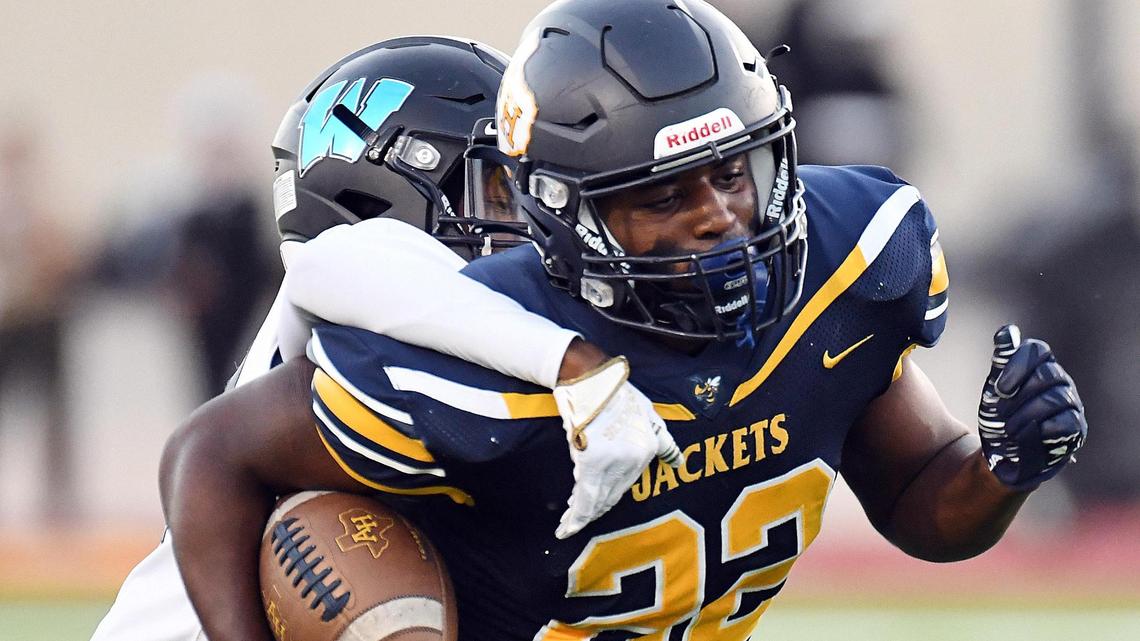 Wyatt’s Xavier Walker, left drags down Fort Worth Arlington Heights’ Brian Furch, as he breaks into the open field for a long run and first down during the first quarter of Friday’s September 30, 2022 District 4-5A Division 2 football game at Farrington Field in Fort Worth, Texas. Special/Bob Haynes