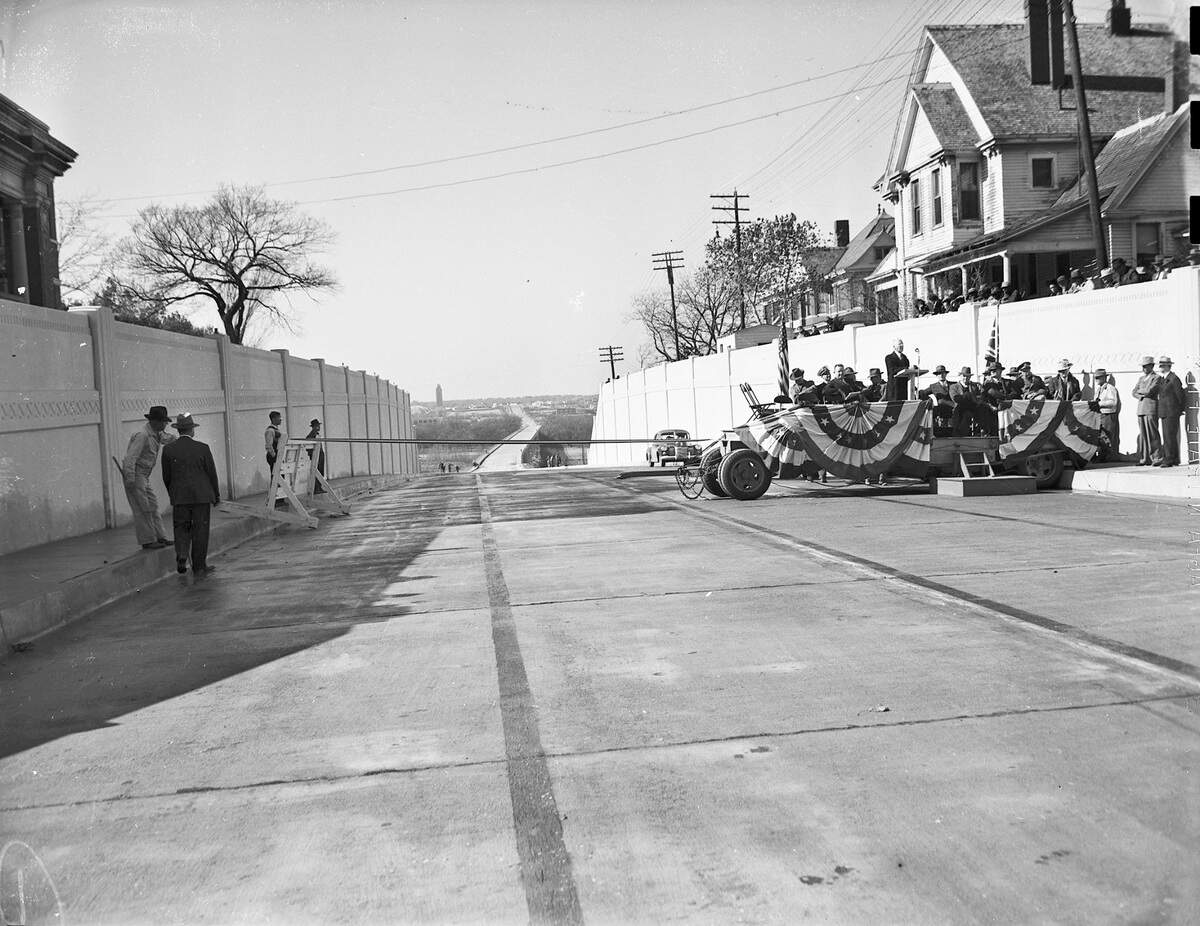 Officials dedicating the connection between West Lancaster Avenue and the bridge across Trinity Park on December 23, 1942. The Will Rogers Tower can be seen in the distance.