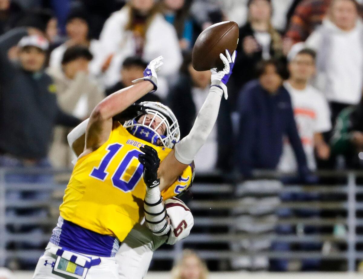 Brock defensive back Jhett Jones (10) intercepts a ball intended for Whitesboro wide receiver Jace Sanders (6) in the second half of a UIL Class 3A D1 Region 1 final football game at C. H. Collins Athletic Complex in Denton, Texas, Thursday, Dec. 01, 2022. Brock defeated Whitesboro 30-19. (Special to the Star-Telegram Bob Booth)