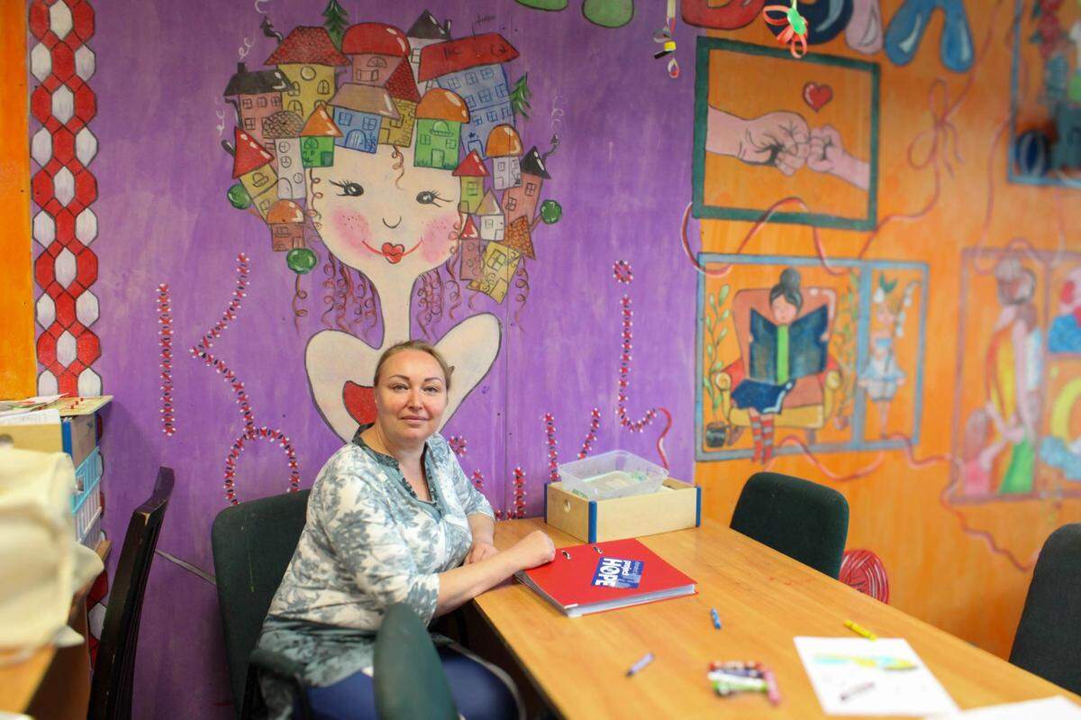 Alla Diagleva, 52, sits in her new classroom in Krakow, where she uses teaching as a distraction from the fact that her Ukrainian family is still living in war, fighting along the front lines in Kherson.