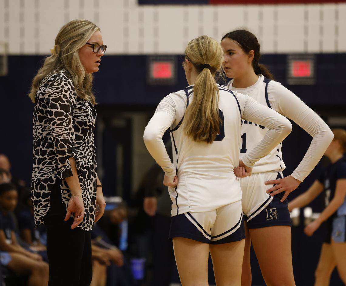 Keller head coach Kate Goldberg talks to Keller guard Lila Russell (0) and shooting guard Audrey Heibel (21) during a break in the action during the first half of a UIL girls basketball game between L.D. Bell and Keller at Keller High School in Keller, Texas, Friday Jan. 16, 2026
