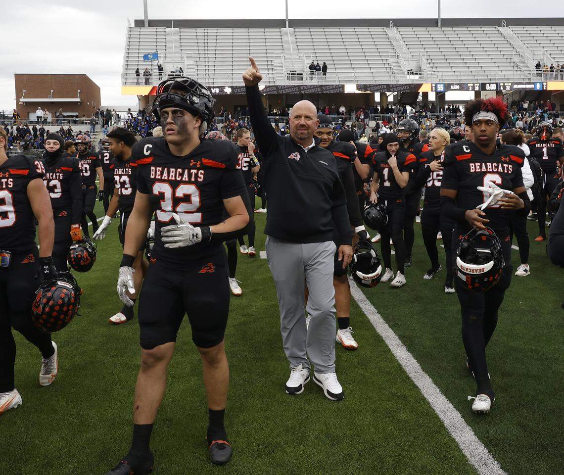 Aledo head coach Robby Jones walks off he field with the team after the Bearcats defeated Fort Worth Arlington Heights in the UIL Class 5A Division I Regional on Friday Nov. 28, 2025 at Crowley ISD Multi-Purpose Stadium in Fort Worth, Texas.
