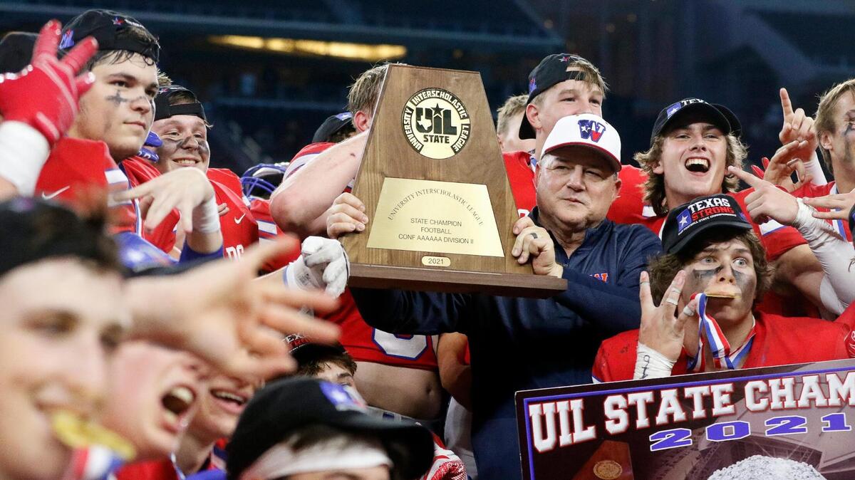 Austin Westlake head coach Todd Dodge holds the UIL State Championship trophy after a high school 6A division 2 state championship football game at AT&T Stadium in Arlington, Texas, Saturday, Dec. 18, 2021. Austin Westlake defeated Denton Guyer 40-21. (Special to the Star-Telegram Bob Booth)
