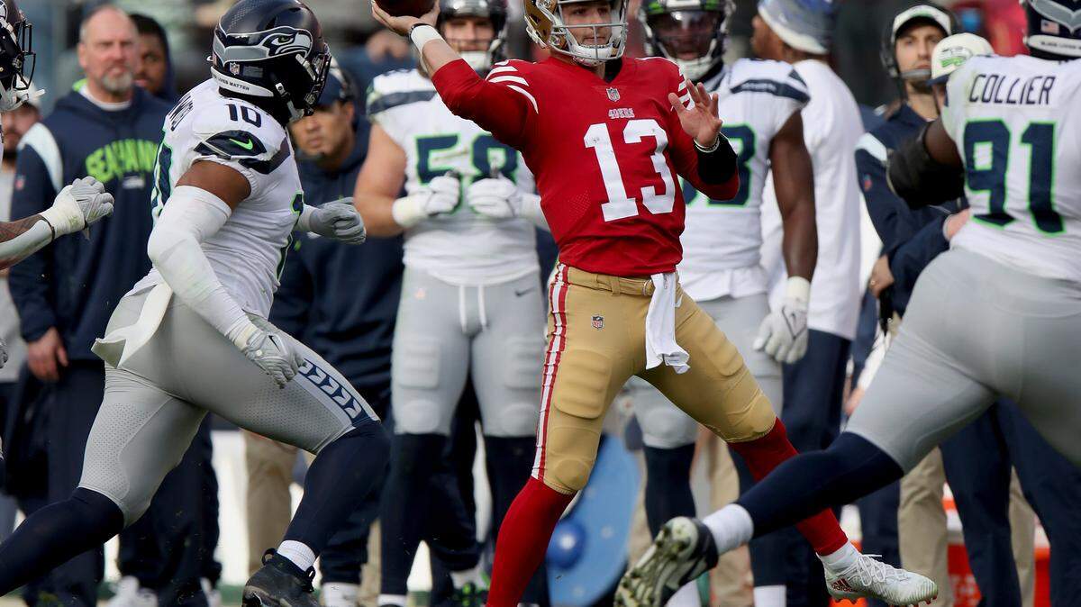 San Francisco 49ers quarterback Brock Purdy (13) throws during an NFL wild card playoff football game against the Seattle Seahawks on Saturday.