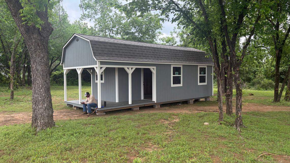 Jeff Pointer, chairman of the Mosier Valley Property Owners Association, sits in front of the planned Mosier Valley Community Office next to Mosier Valley Park, 11220 Mosier Valley Road. The office will provide resources for community homeowners, information on the history of Mosier Valley, and memorabilia.