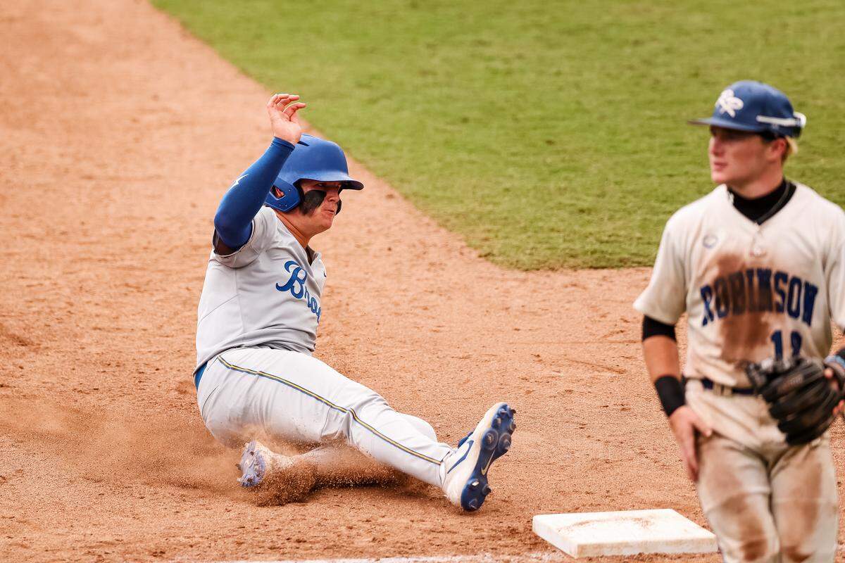 Brock third baseman Asher Strait (20) slides into third base against Robinson in the UIL Class 4A Division II baseball state championship game on Friday, June 5, 2026, at Dell Diamond in Round Rock, Texas.