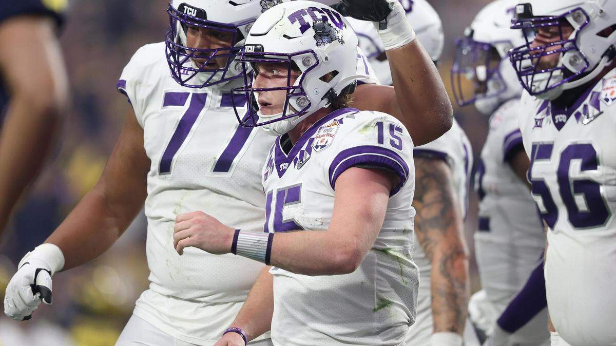 TCU teammates celebrate a touchdown by quarterback Max Duggan, 15, during the Vrbo Fiesta Bowl at State Farm Stadium in Glendale, Ariz., on Saturday, December 31, 2022.