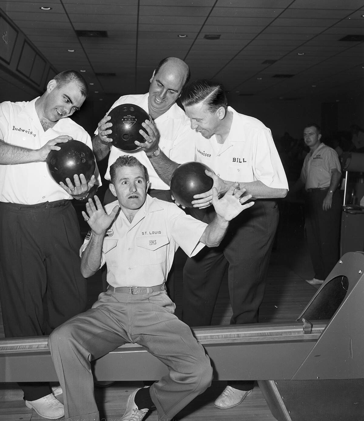 Sept. 1, 1958: Ray Bluth, Capt. Pat Patterson and Bill Lillard, left to right, of the St. Louis Budweisers, take aim at Harry Smith of the St. Louis Falstaffs between rounds of the Labor Day bowling tournament at Great Southwest Lanes.