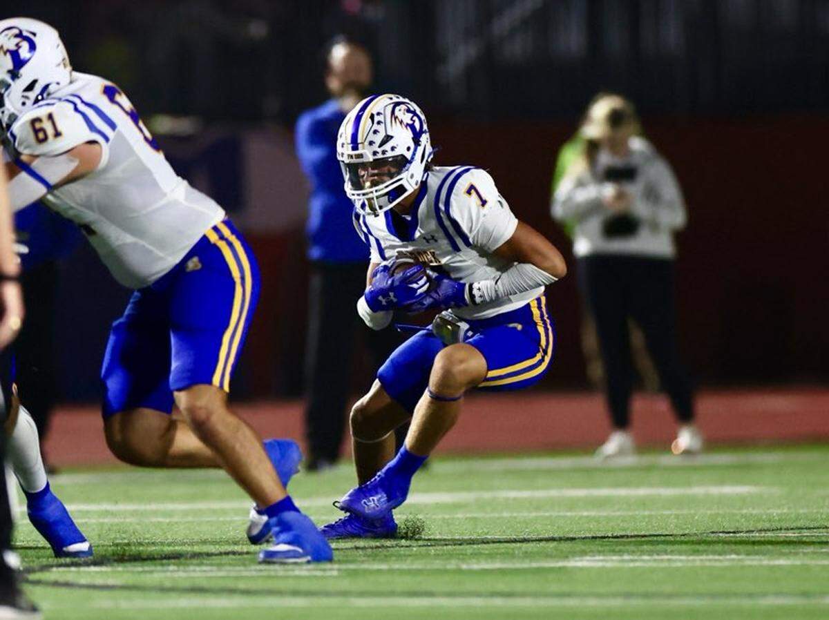 Brock’s Colt Matlock (7) looks for room to run behind the block of Beckham Friesen (61) against Graham on Friday, Nov. 1, 2024 at Newton Field in Graham, Texas.