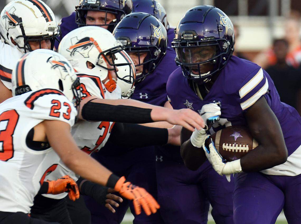 Haltom’s Pedro Acevedo, left and Damian Sanders moves towards Chisholm Trail’s Shone Mombo as he rushes for positive yards in the first quarter of their district 3-6A football game Friday, September 17, 2021 at Chisholm Trail High School in Saginaw, Texas. Special/Bob Haynes