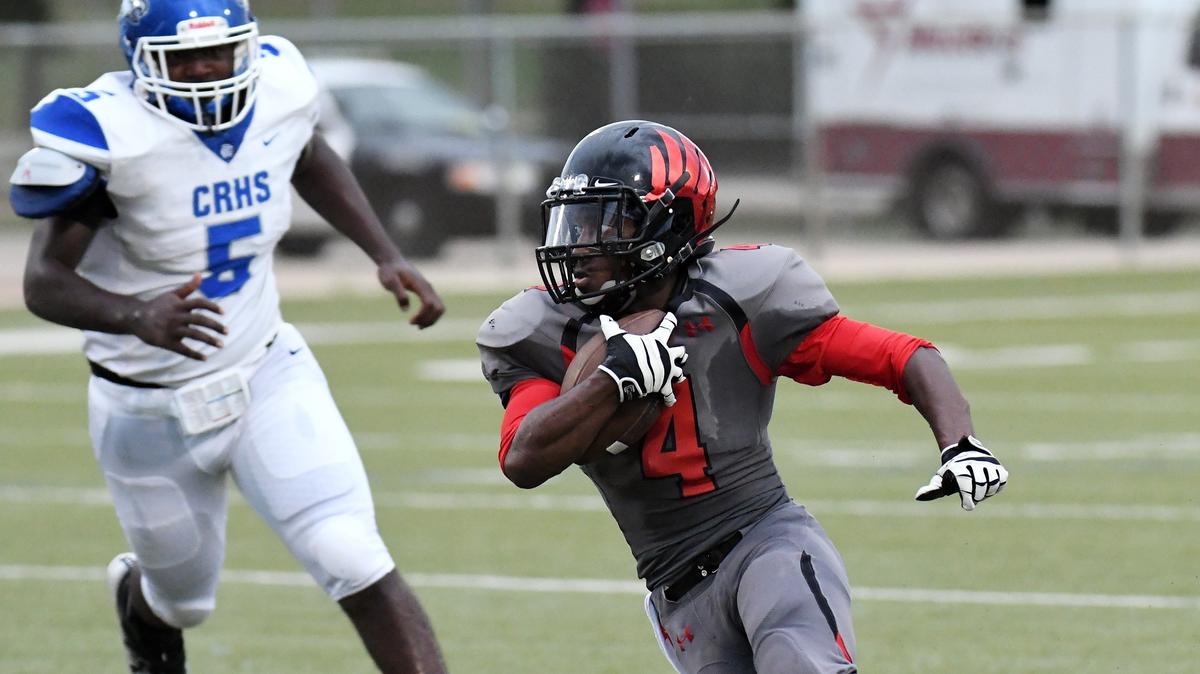 Diamond Hill-Jarvis’s Eddrick Hampton, right, cuts back into the open field in front of Carter-Riverside’s Jonah  Delgado as he gets first down yardage in the second quarter during Friday’s  September 21, 2018 football game at Handley Field in Fort Worth. Special/Bob Haynes