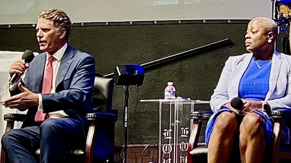 Crystal Gayden, right, chair of the Tarrant County Democratic Party, looks on as Republican county chair Bo French speaks June 11, 2024, at a forum hosted by the Arlington branch of the NAACP at Greater Community Missionary Baptist Church.