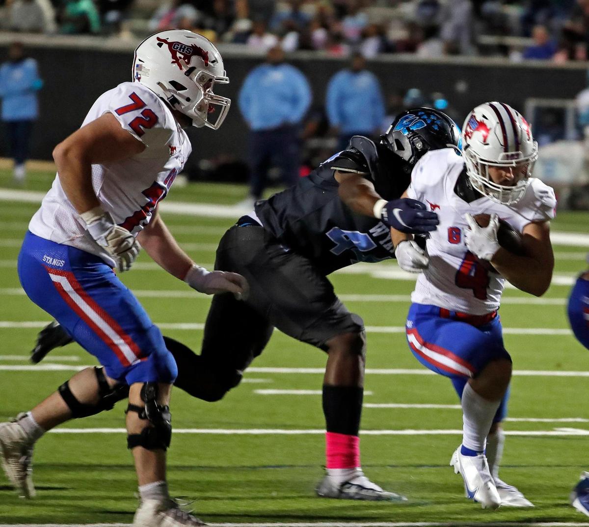 Grapevine running back Parker Polk (4) takes it up the middle for another touchdown in the second half of a District 4-5A Division 2 football game at Scarborough-Handley Field in Fort Worth, Texas, Thursday, Oct. 20, 2022. Grapevine defeated O.D. Wyatt 49-21. (Special to the Star-Telegram Bob Booth)