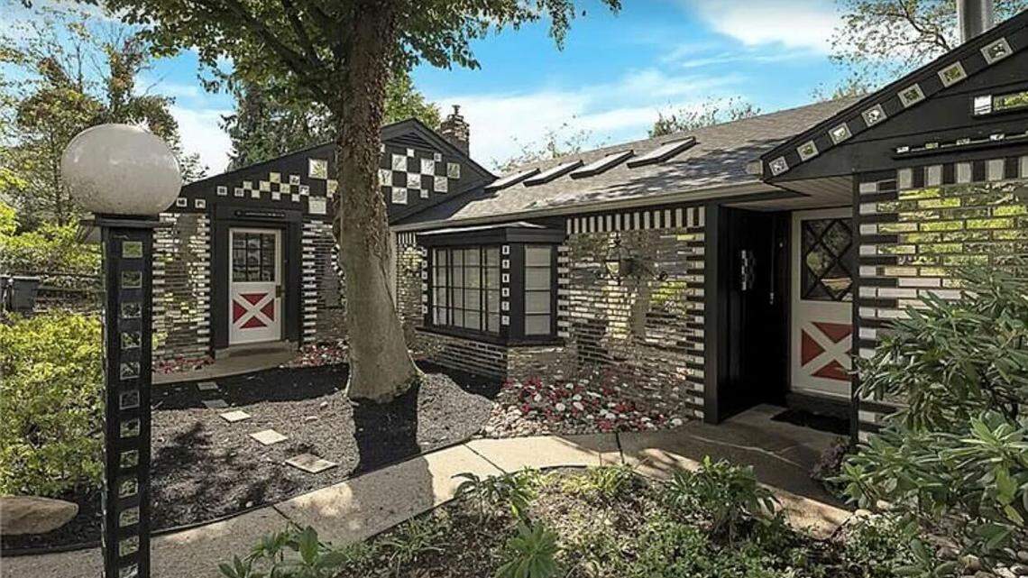 The listing description says the home is “known as the Mirror House among its legions of fans.”