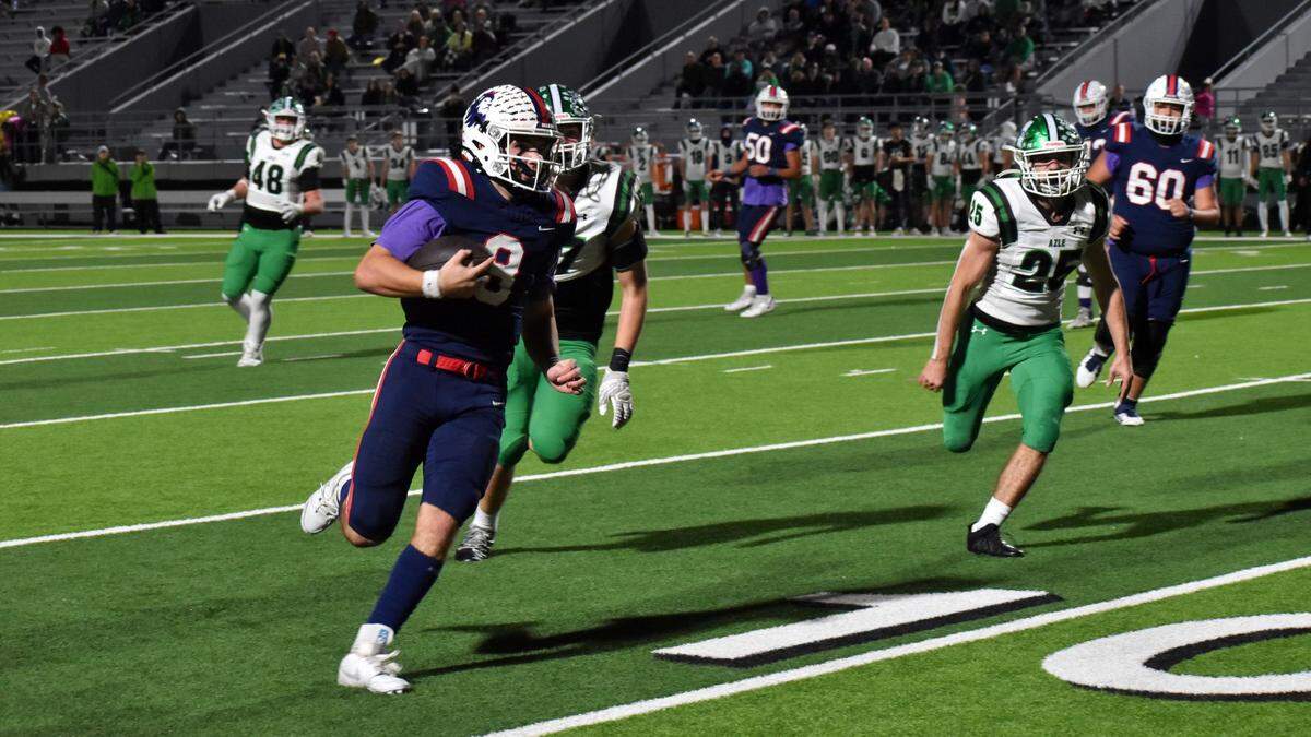 Richland quarterback Drew Kates runs for an 11-yard touchdown run in the first quarter of a UIL football game against Azle at Birdville ISD Fine Arts/Athletics Complex on Friday, Nov. 8, 2024.
