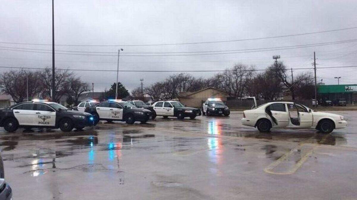 South patrol and fugitive officers converge on a car occupied by capital murder suspect Aaron Rios.
