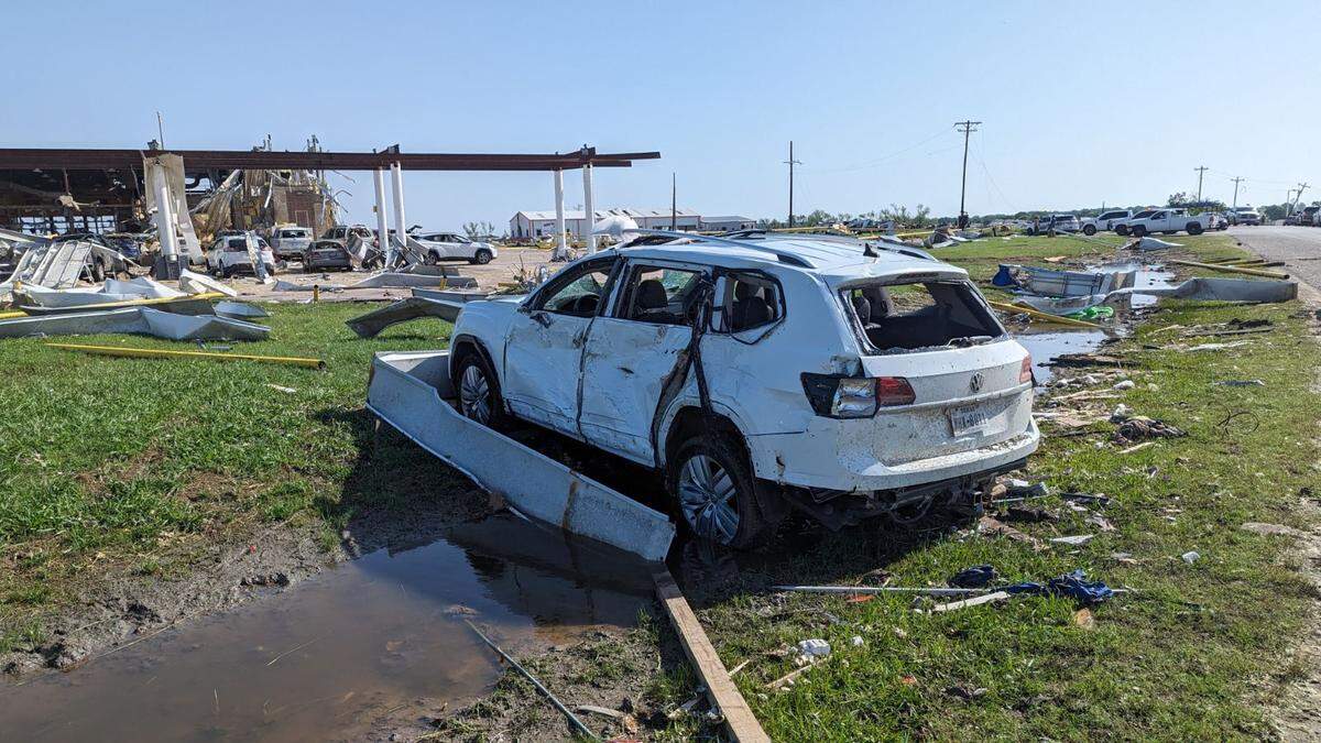 A damaged car near a gas station at Lone Oak Road and Interstate 35 in Valley View, Texas, on Sunday, May 26, 2024, after a line of severe storms rolled through Cooke County. The Sheriff’s Office said dozens of people took shelter inside the gas station.