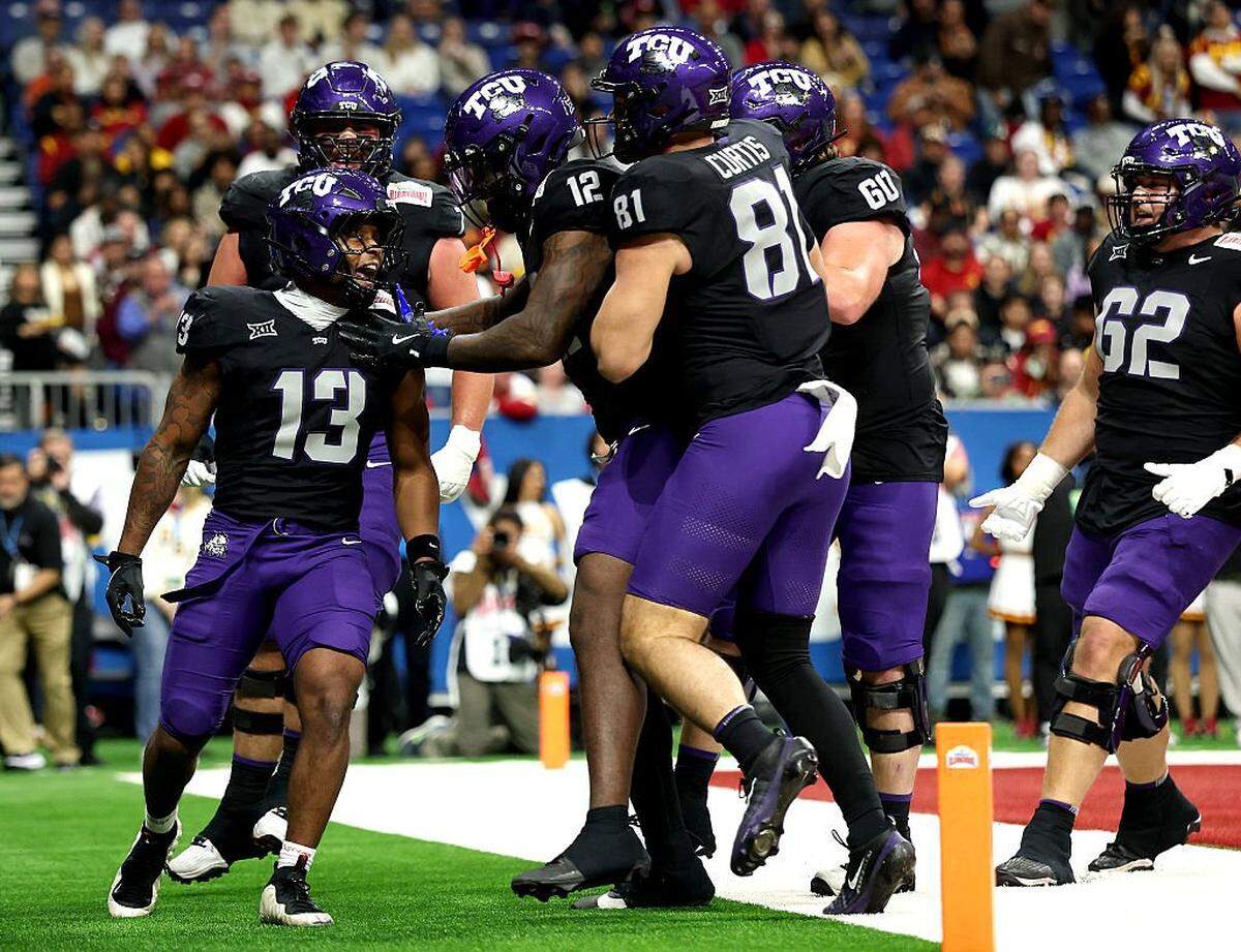 SAN ANTONIO, TEXAS - DECEMBER 30: Jon Denman #13 of the TCU Horned Frogs celebrates with teammates after scoring a touchdown during the second quarter of the game against the USC Trojans at Alamodome on December 30, 2025 in San Antonio, Texas. (Photo by Kenneth Richmond/Getty Images)