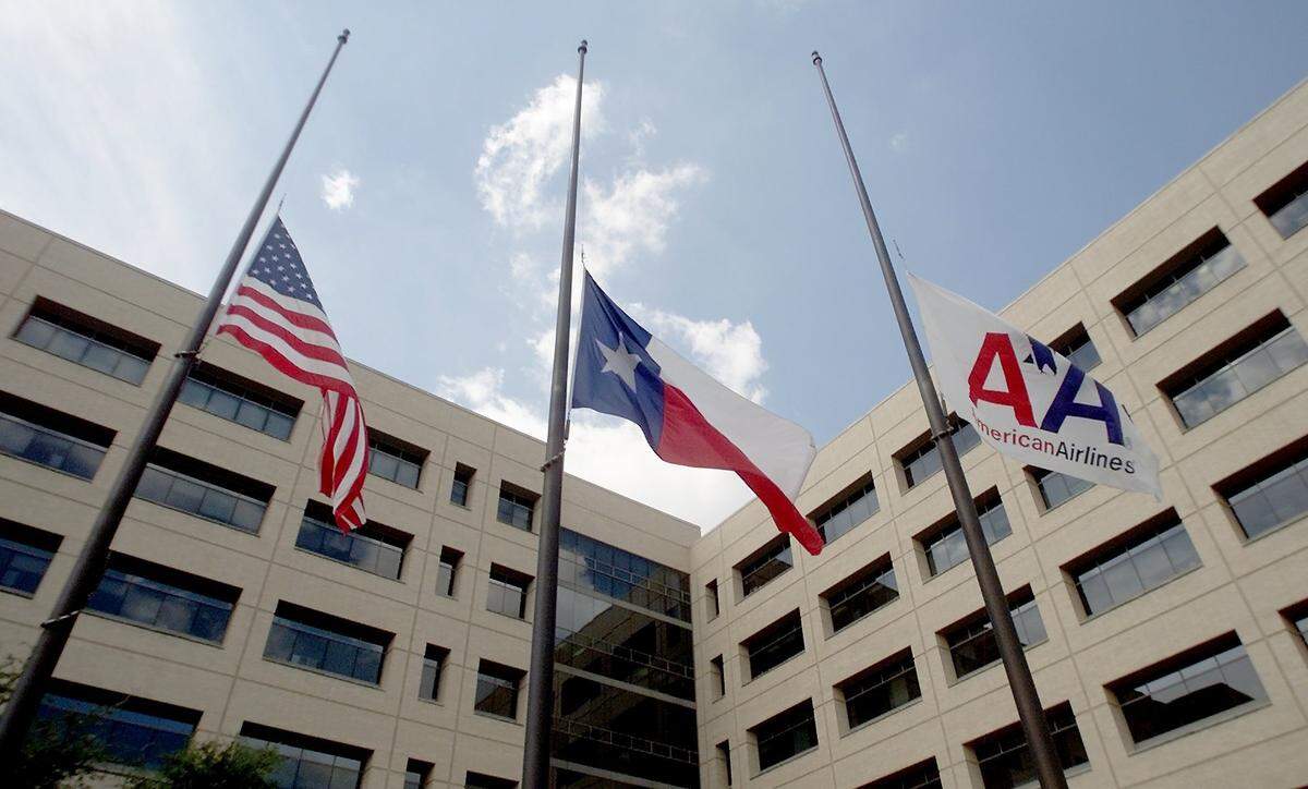 Flags lowered outside American Airlines headquarters in Fort Worth on Sept. 11.