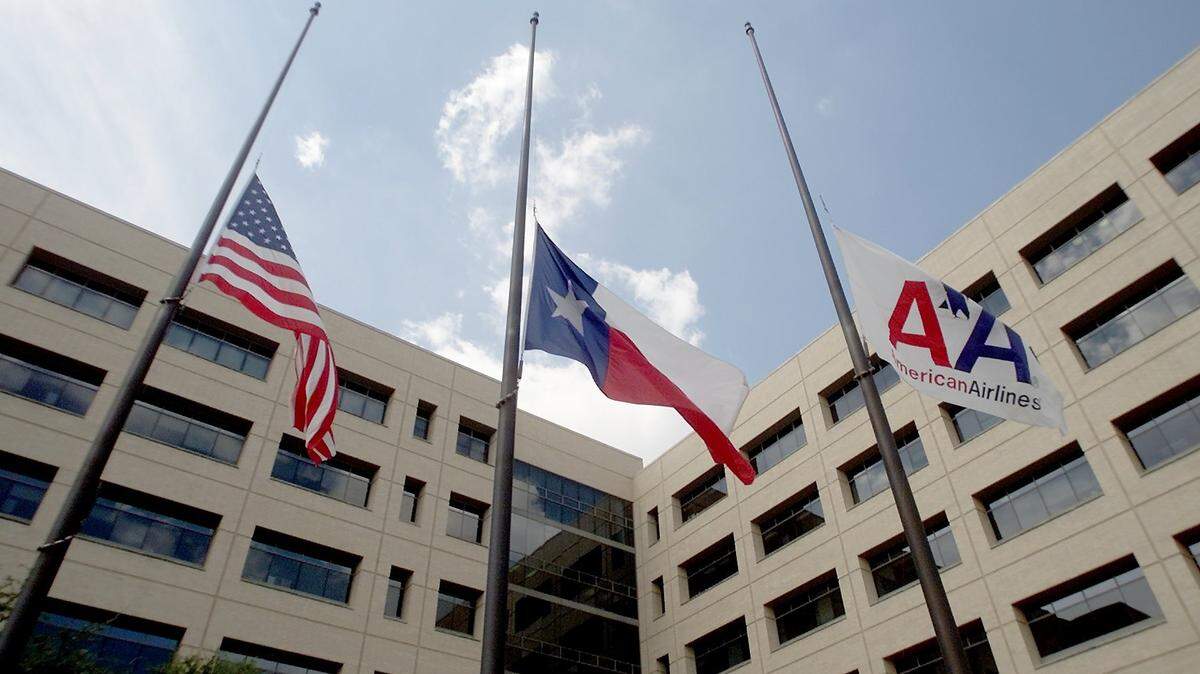 In this 2001 photo, flags are lowered outside American Airlines headquarters in Fort Worth.